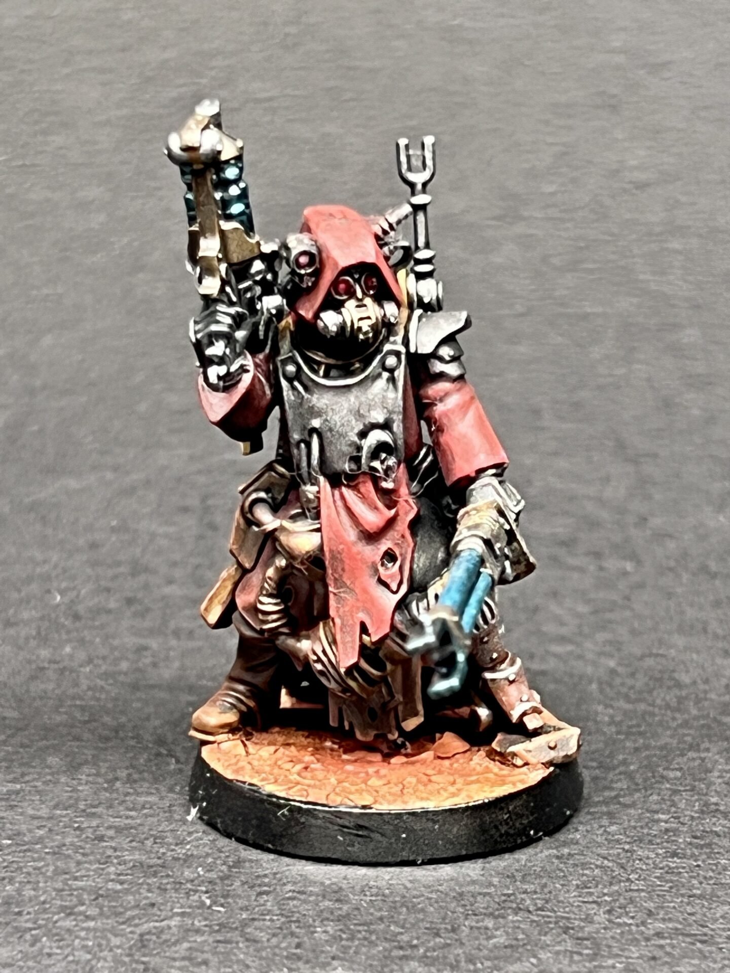 Skitarii Ranger Alpha miniature from the Adeptus Mechanicus, showing detailed power weapon and galvanizing pistol.
