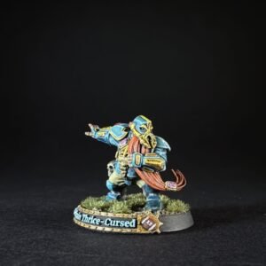Colorfully painted fantasy miniature of a blue-armored warrior with a red scarf, standing on a grassy base with a banner that reads 'Cursed' or '...-Price-Cursed' at the edge (informative figure).