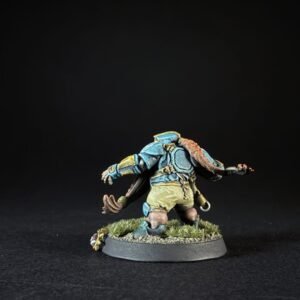 Back view of a painted fantasy miniature armored warrior in blue plates with a brown scarf, standing on a grassy base.