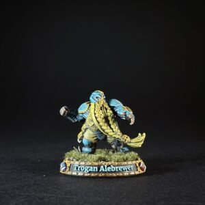 Miniature figure of Trogan Alebrewer, a blue-skinned warrior with gold trim, standing on grassy base.