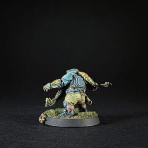 Back view of a blue-armored fantasy miniature standing on a grassy base.