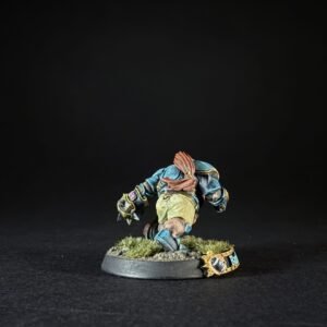 Miniature fantasy orc/ogre figure in blue armor leaning forward on a grassy base, mid-stride pose.
