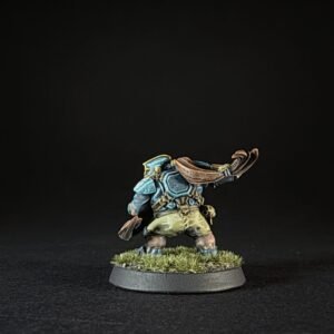 Painted tabletop miniature of a stout armored orc-like warrior standing on a grassy round base, raising a curved brown cloak/arm at the side.