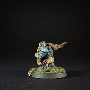 Small fantasy miniature of a armored dwarf with blue cloak, standing on a grassy base.