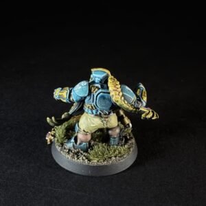 Painted miniature of a blue armored orc-like figure with a long yellow braid, arms out, standing on a grassy rocky base.