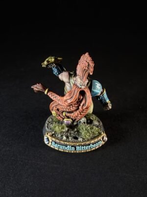 Painted dwarf miniature Barundin Bitterbeam, with a long orange beard, in a battle stance on a rocky base.