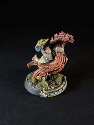 Painted fantasy miniature of a muscular humanoid entwined with a red dragon tail, standing on a rocky base with tufts of grass and a name banner reading Barundin.