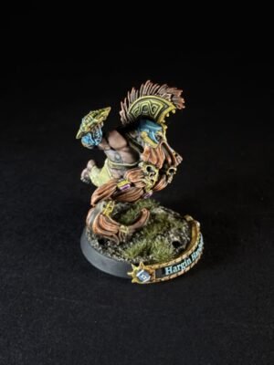 Painted fantasy miniature: blue-skinned warrior with an ornate yellow crest helmet, standing on a grassy base that reads 'Hargin Har'.