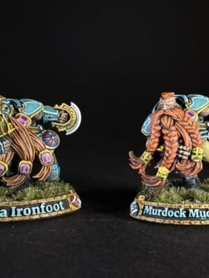 Two colorful fantasy dwarf miniatures on grassy bases, facing opposite directions, with name banners reading 'Della Ironfoot' and 'Murdock Mud­singer' (or similar).