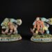 Two colorful fantasy dwarf miniatures on grassy bases, facing opposite directions, with name banners reading 'Della Ironfoot' and 'Murdock Mud­singer' (or similar).