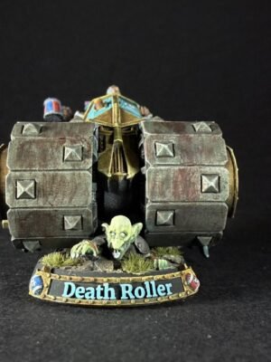 Fantasy miniature: a rugged Warhammer-style rolling armor with square plates, a goblin crouching at its front, on a round base labeled Death Roller.