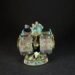 Front view of a painted Death Roller miniature war machine with teal cockpit, armored wheels, and goblin crew on a round base.