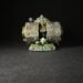 Miniature model of a Death Roller war machine with a goblin crew, on a grassy base labeled 'Death Roller' against a black background.