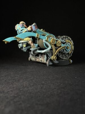 Miniature steampunk motorcycle with teal and gold gears and a rider, set against a black background.