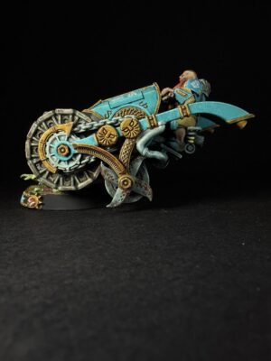 Teal and gold steampunk motorcycle model with large gear wheel and ornate gears, carrying a rider in armor.