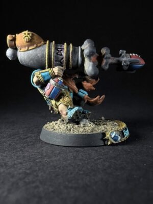 IMG_1121 Painted dwarf artillery miniature firing a oversized cannon, colorful armor, standing on a rocky base against a black background.