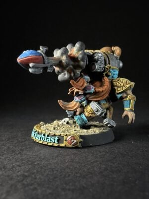 IMG_1126 Painted fantasy miniature of a horned armored warrior firing a large cannon, standing on a rocky base with a turquoise banner reading 'Harblast'.
