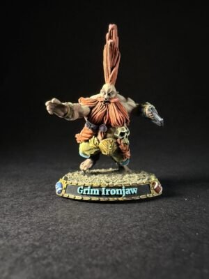 Miniature dwarf figure Grim Ironjaw with a tall orange beard, muscular build, armor, and outstretched arms on a rocky base.