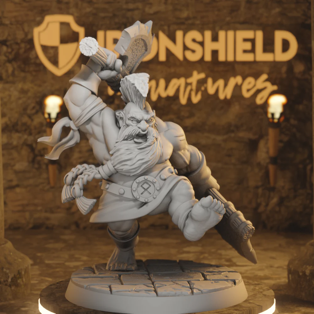 Fantasy dwarf miniature in a dynamic battle pose, raising a large hammer on a cracked stone base with a dim Ironshield backdrop.