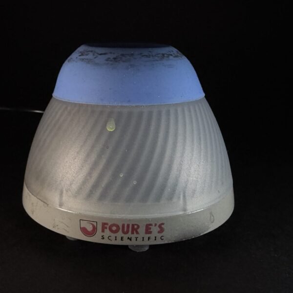 Cone-shaped, ribbed lamp with a blue top and gray base on a dark surface; brand reads 'FOUR'S SCIENTIFIC'.
