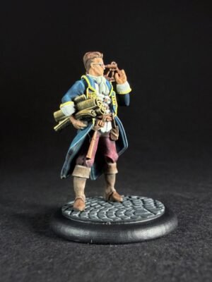 IMG_1451 Miniature of a Victorian-style explorer in a blue coat with yellow trim, holding a telescope to his eye and carrying rolled maps on his side, standing on a textured base with cobblestone pattern.