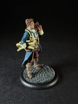 IMG_1460 Miniature explorer in a blue coat with a telescope to the eye, carrying rolled parchments, standing on a cobblestone base.