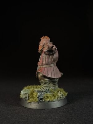 IMG_1497 Painted miniature of a medieval knight in pink armor standing on a grassy base, facing forward with a pointed gesture.