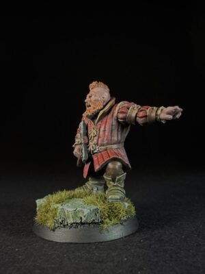 IMG_1498 Fantasy dwarf miniature in red armor with beard, standing on a grassy rocky base, arm extended forward.