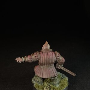 Rear view of a pink-armored medieval knight miniature, holding a sword, standing on a grassy base.