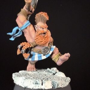 Fantasy dwarf warrior miniature with orange beard, hammer raised, blue scarf, and striped belt standing on a rocky base.