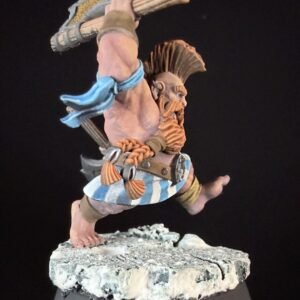 Fantasy dwarf warrior miniature, bare-ch chest, braided beard, blue scarf, striped kilt, and a large hammer raised as if mid-swing on a rocky base