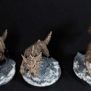 IMG_1886 Three fenrisian wolves miniatures standing on rocky, snow-covered