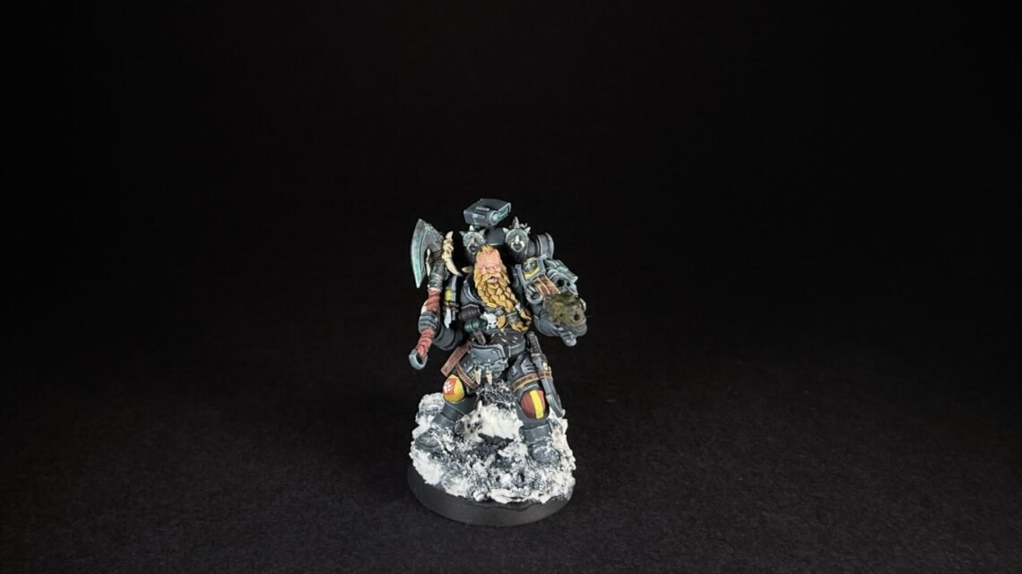 Painted Space Wolves Wolf Scout Pack Leader with plasma pistol and power weapon on snowy base