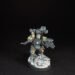 Painted Wolf Scout Fangbearer with Absolvor Bolt Pistol and Combat Blade on snowy base.