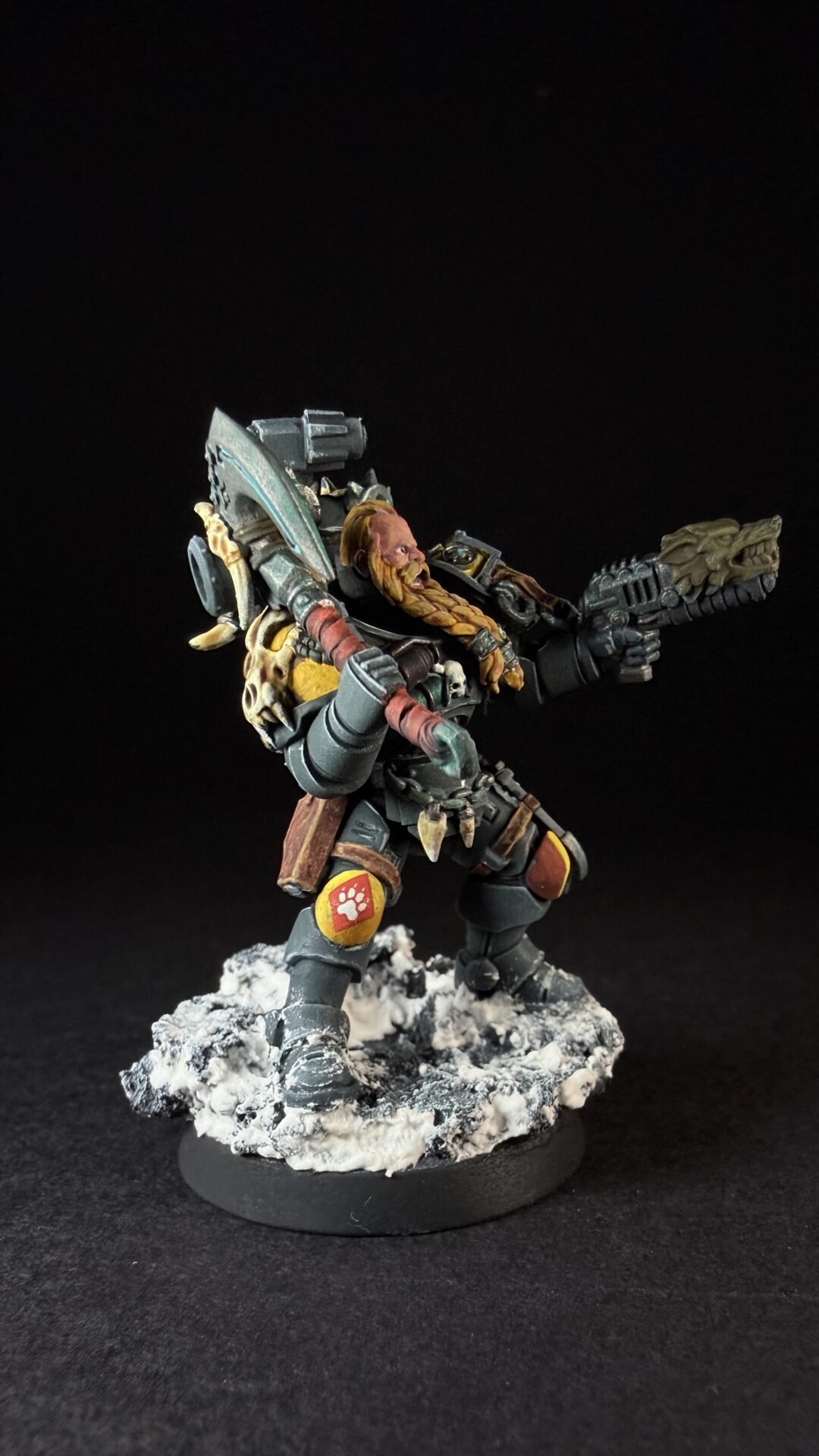 Painted Space Wolves Wolf Scout Pack Leader with plasma pistol and power weapon on snowy base