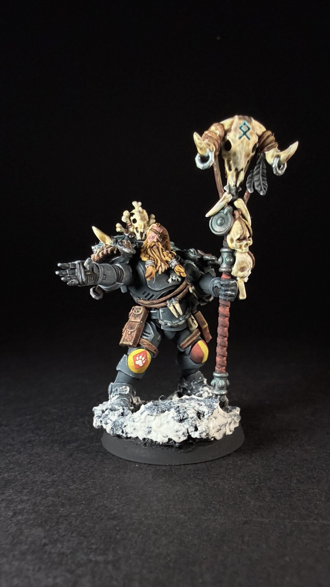 Painted Wolf Scout Rune Priest Skjald with Bolt Pistol and Runic Staff on snowy base.