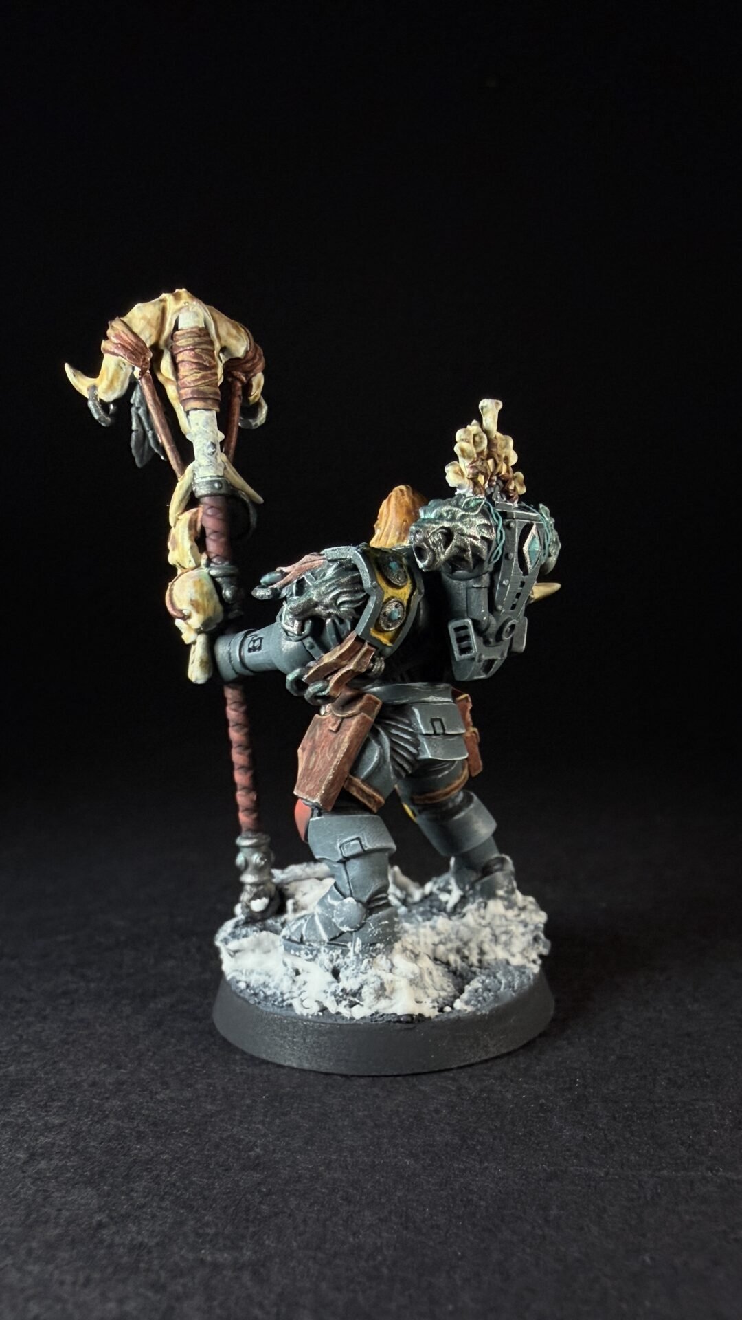 Painted Wolf Scout Rune Priest Skjald with Bolt Pistol and Runic Staff on snowy base.