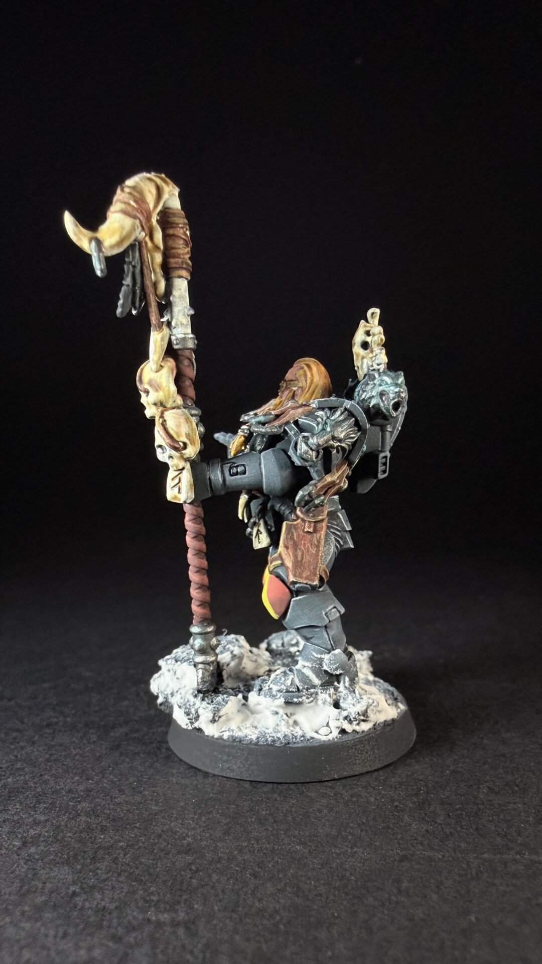 Painted Wolf Scout Rune Priest Skjald with Bolt Pistol and Runic Staff on snowy base.