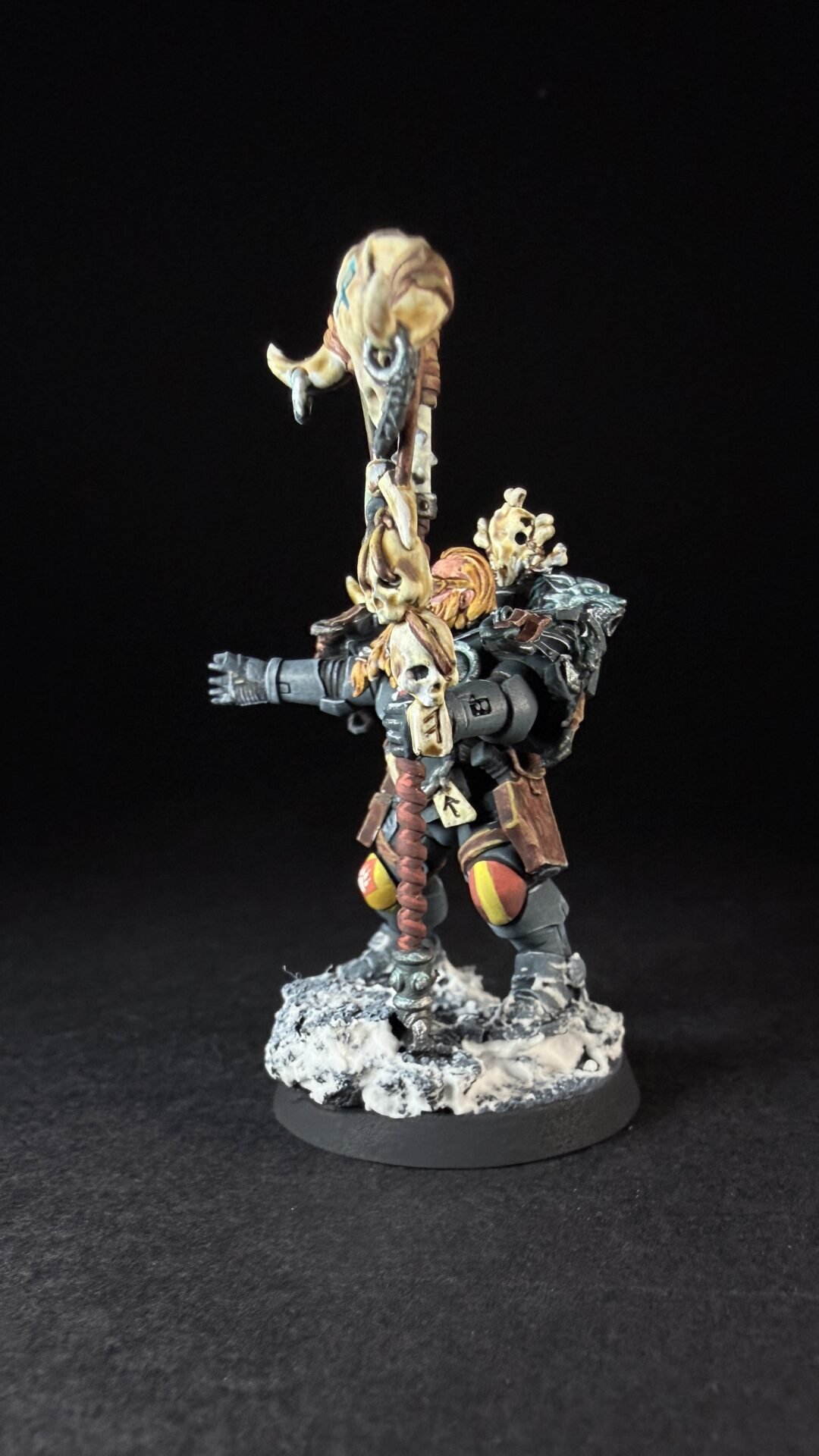 Painted Wolf Scout Rune Priest Skjald with Bolt Pistol and Runic Staff on snowy base.