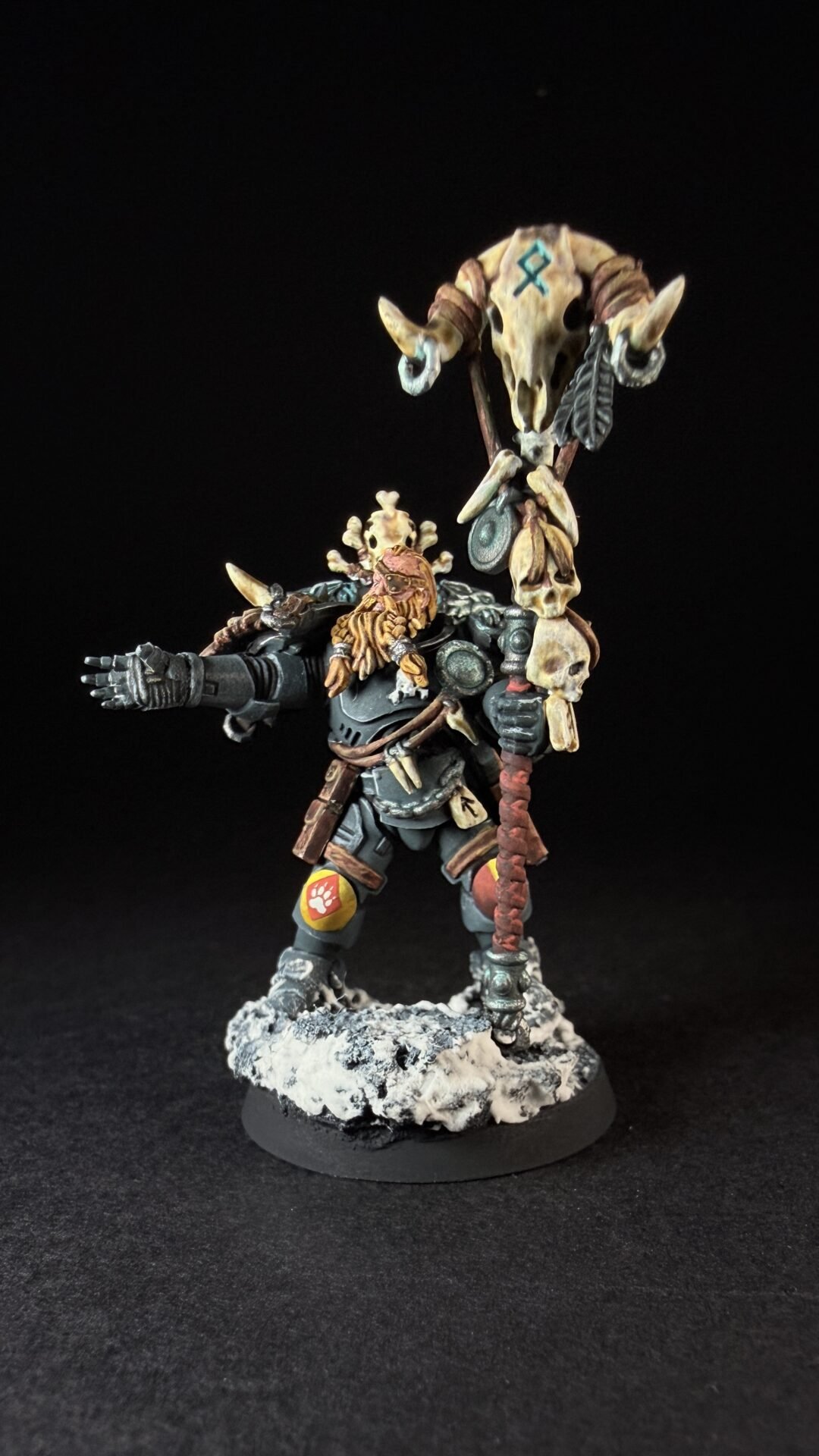 Painted Wolf Scout Rune Priest Skjald with Bolt Pistol and Runic Staff on snowy base.
