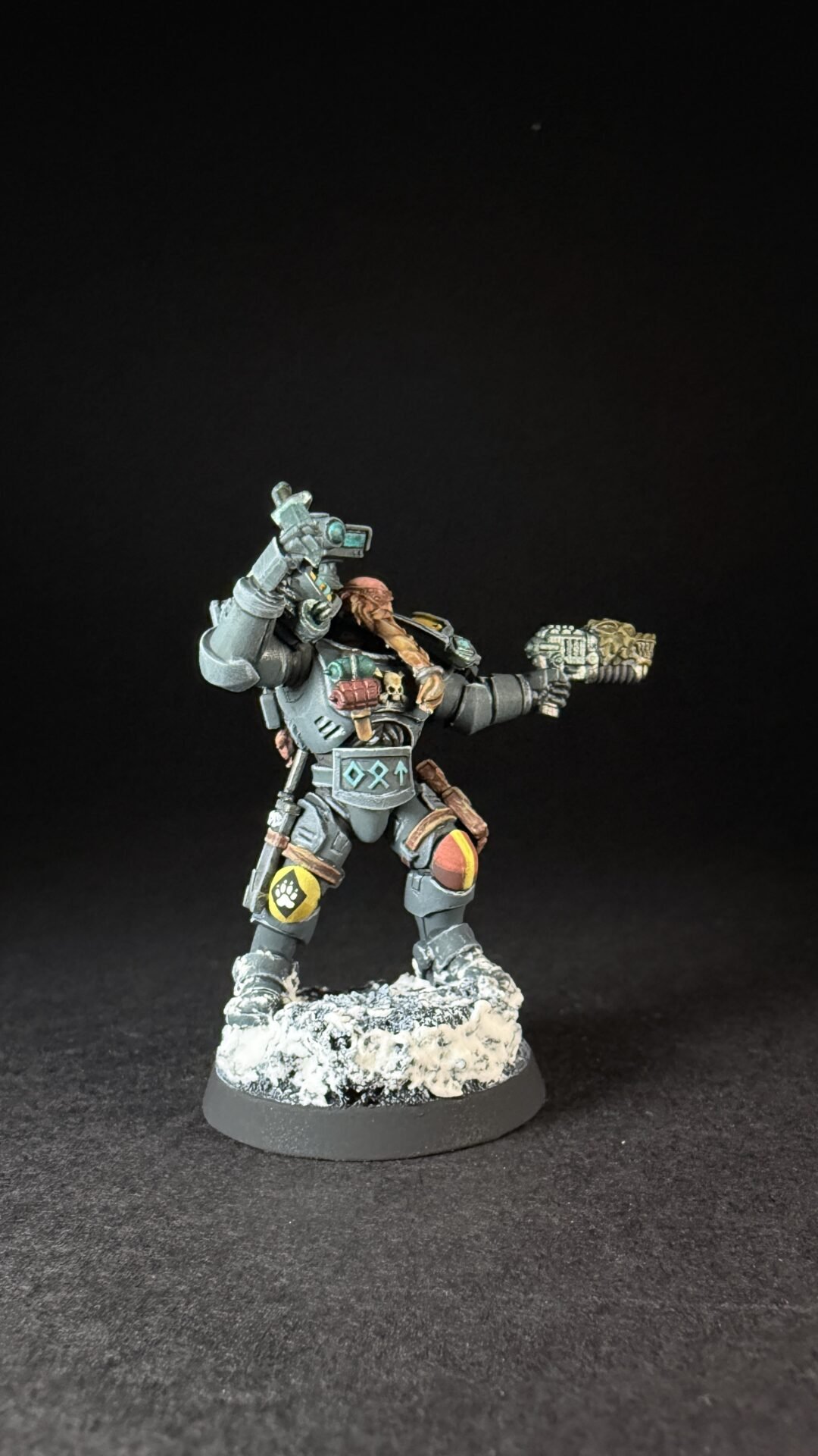 Painted Wolf Scout Hunter with Plasma Pistol and Combat Blade on snowy base.