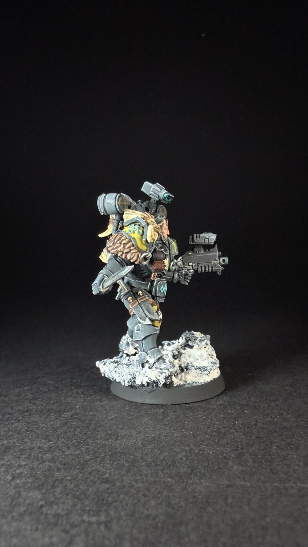 Painted Wolf Scout Fangbearer with Absolvor Bolt Pistol and Combat Blade on snowy base.