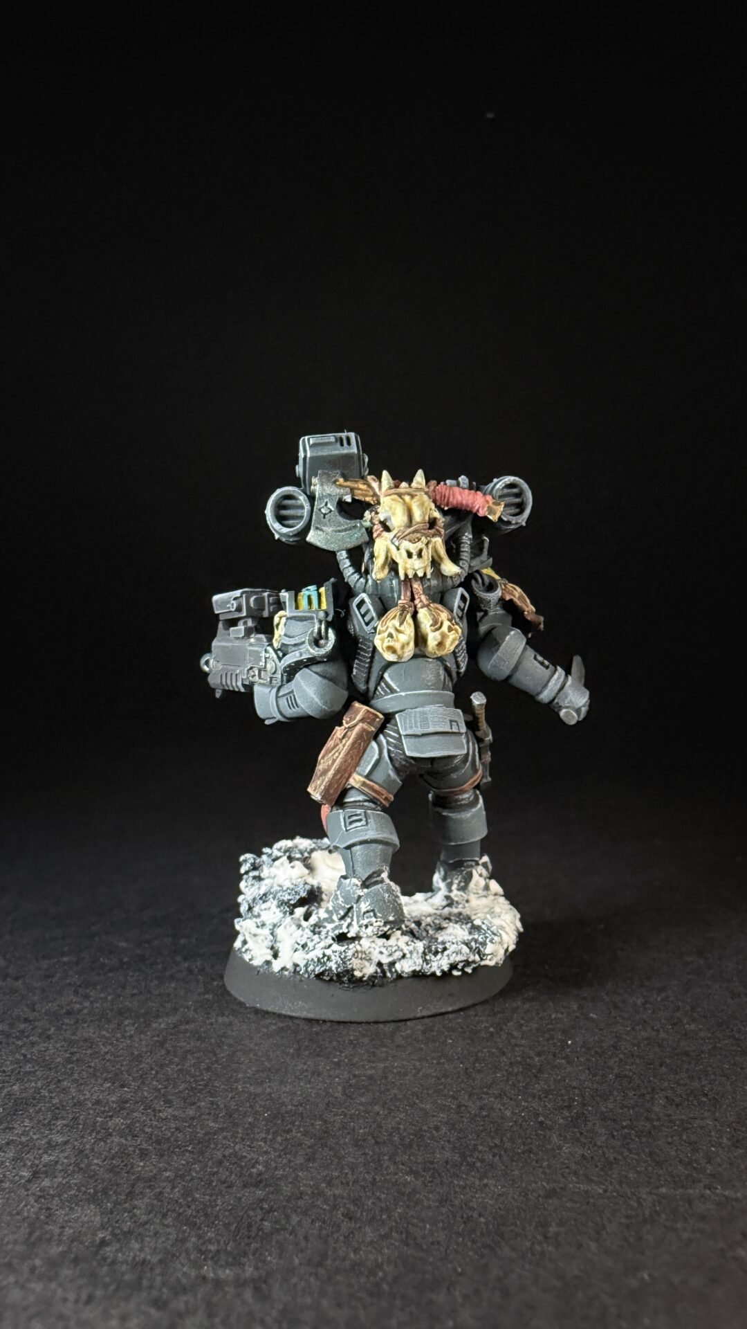 Painted Wolf Scout Fangbearer with Absolvor Bolt Pistol and Combat Blade on snowy base.