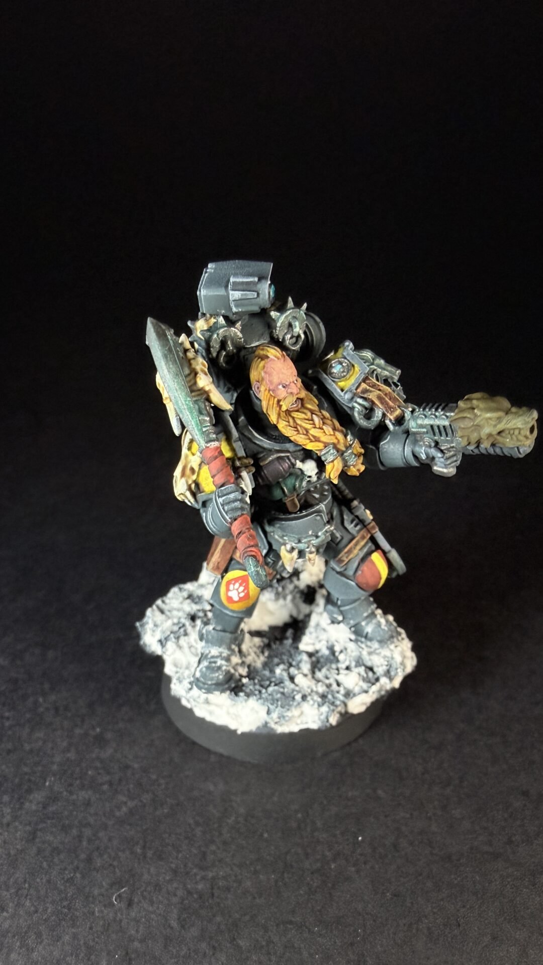 Painted Space Wolves Wolf Scout Pack Leader with plasma pistol and power weapon on snowy base