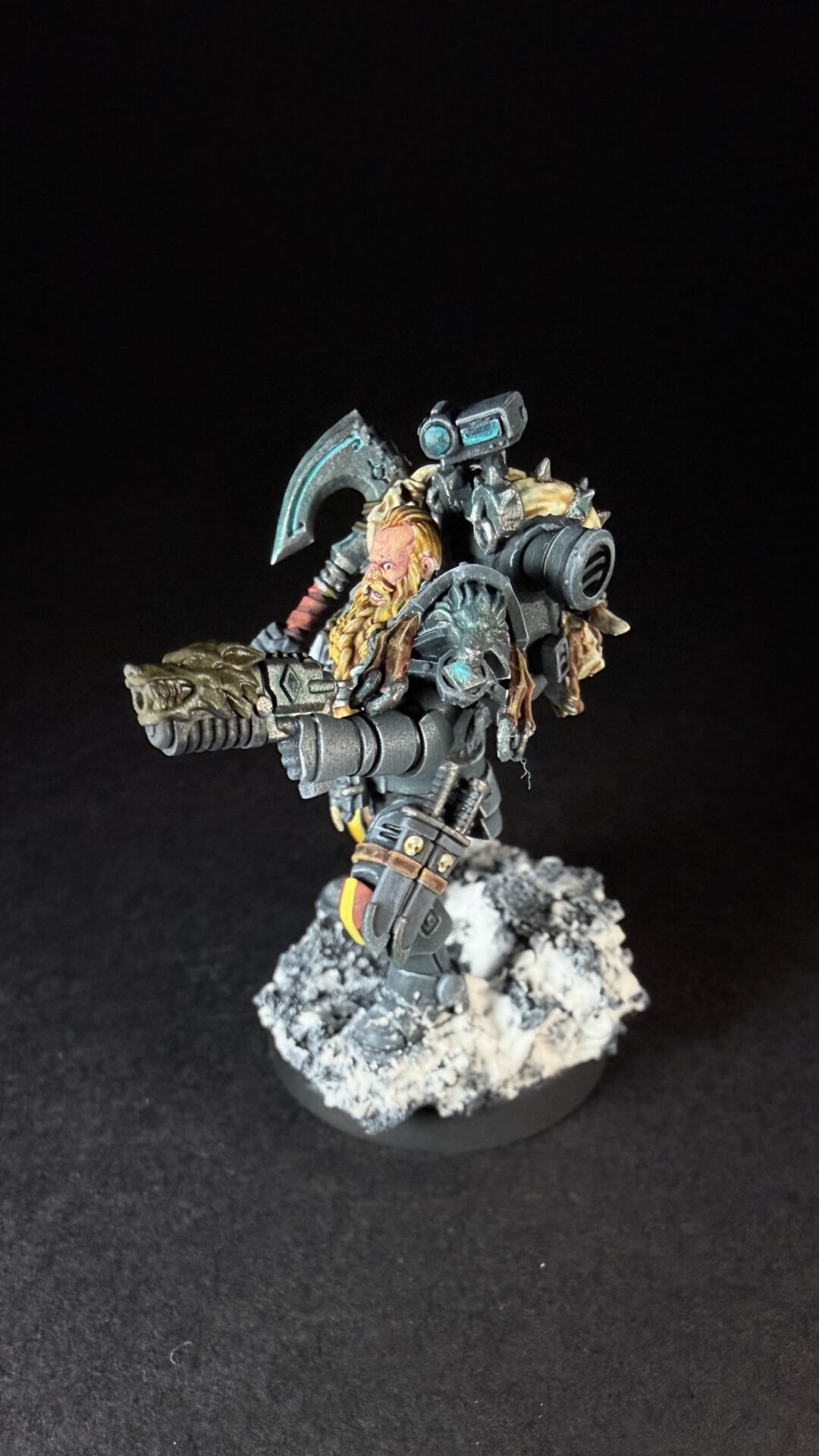 Painted Space Wolves Wolf Scout Pack Leader with plasma pistol and power weapon on snowy base