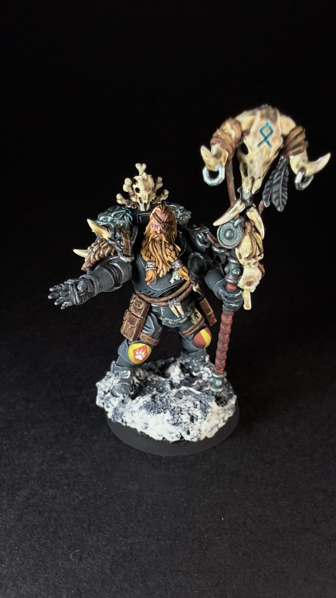 Painted Wolf Scout Rune Priest Skjald with Bolt Pistol and Runic Staff on snowy base.