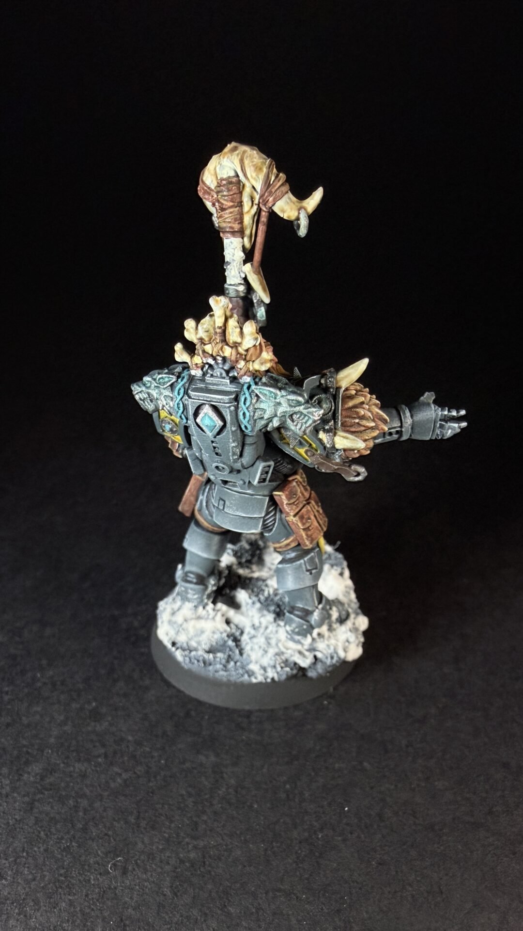 Painted Wolf Scout Rune Priest Skjald with Bolt Pistol and Runic Staff on snowy base.