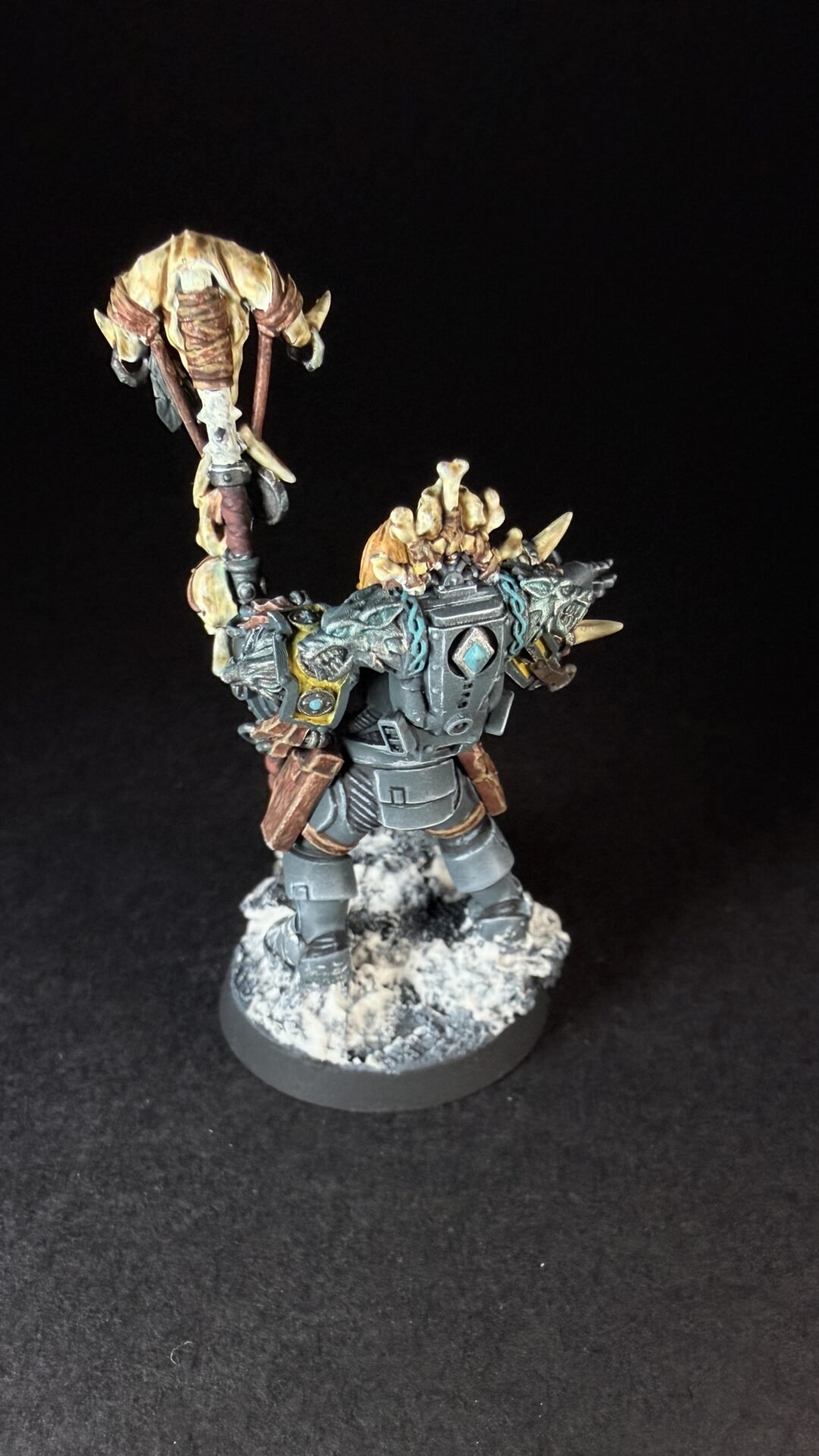 Painted Wolf Scout Rune Priest Skjald with Bolt Pistol and Runic Staff on snowy base.