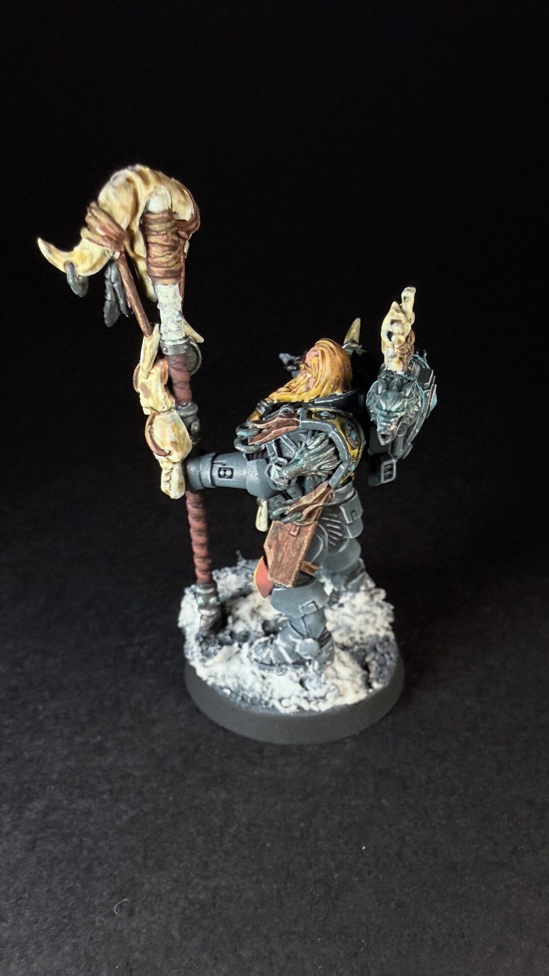 Painted Wolf Scout Rune Priest Skjald with Bolt Pistol and Runic Staff on snowy base.