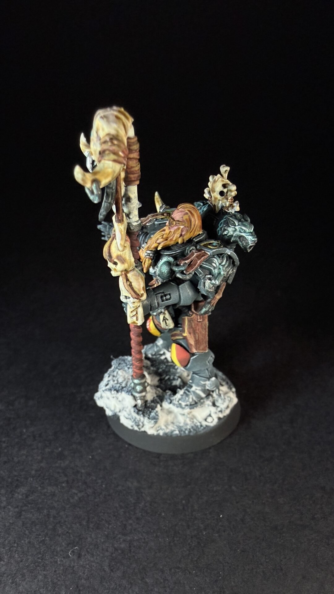 Painted Wolf Scout Rune Priest Skjald with Bolt Pistol and Runic Staff on snowy base.